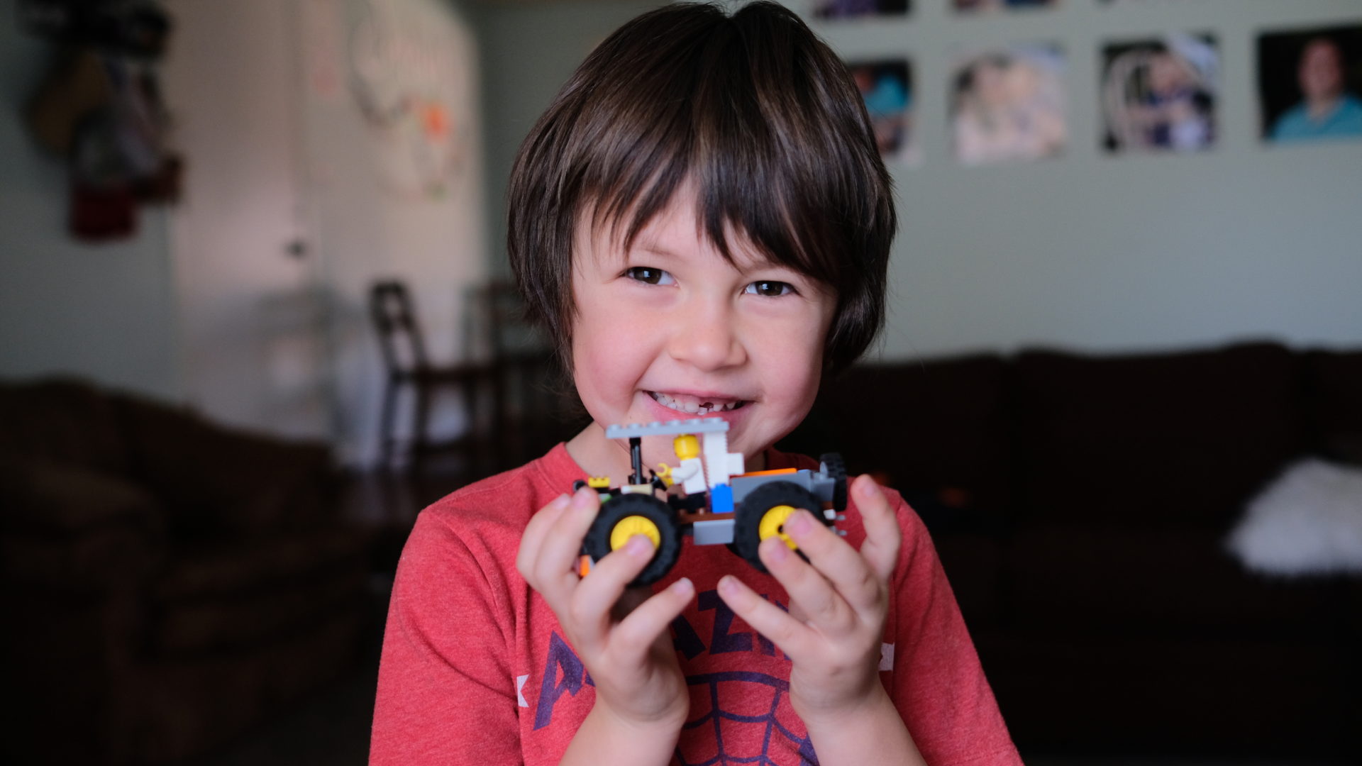 Emmett shows off the LEGO truck that he built on his own, no plans.