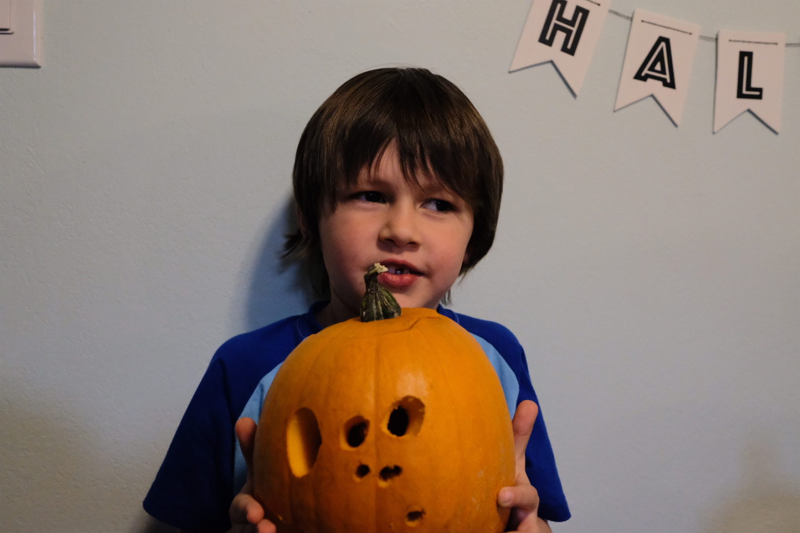 Emmett holds his pumpkin