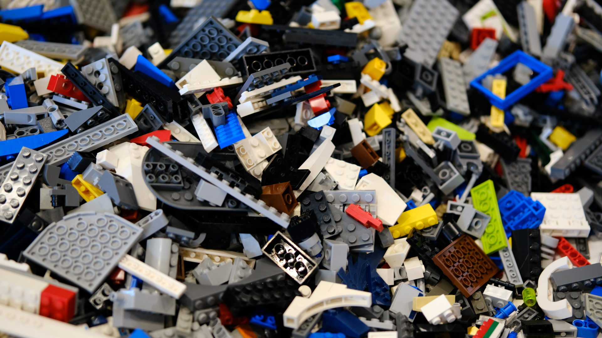 A close up of bulk and scattered LEGO parts at Bricks and MiniFigs in Orem, Utah