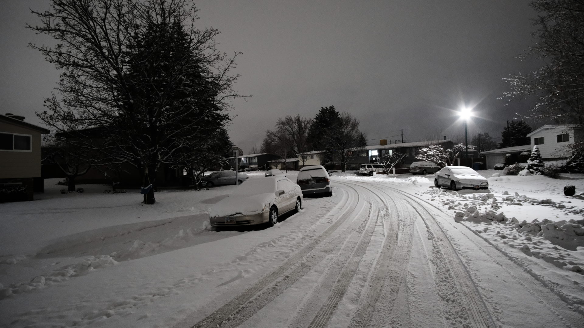 A snow covered street early in the morning in Orem, Utah