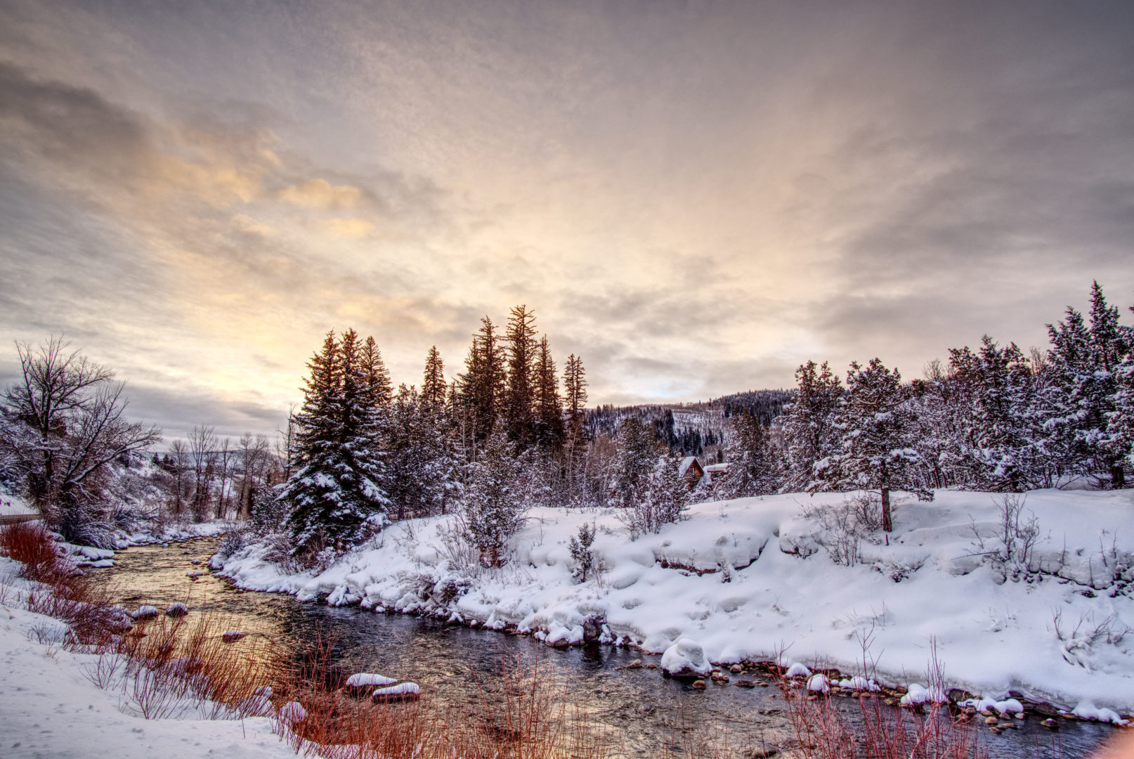 A snowy morning on the banks of the Provo River in Kamas, Utah on the way to the Wolf Creek Pass